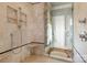Shower stall detailed with designer tile, glass surround, and rainfall shower head at 1426 Merrimont Ave, Kings Mountain, NC 28086