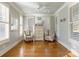 Bright sitting area with hardwood floors, neutral paint, and shuttered windows at 1426 Merrimont Ave, Kings Mountain, NC 28086