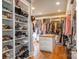 Spacious walk-in closet with custom shelving and hardwood floors at 1426 Merrimont Ave, Kings Mountain, NC 28086