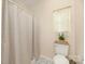 Bathroom featuring tile floors, a toilet, and a shower with curtain at 1513 Fletcher Broome Rd, Monroe, NC 28112