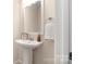 Cozy bathroom features modern sink and fixtures, a white towel, and natural lighting at 1513 Fletcher Broome Rd, Monroe, NC 28112