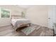 Bedroom featuring wood-look floors, a queen bed, and decor at 1513 Fletcher Broome Rd, Monroe, NC 28112