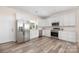 Kitchen featuring stainless steel appliances, white cabinetry, and stone countertops at 1513 Fletcher Broome Rd, Monroe, NC 28112