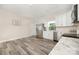 Light-filled kitchen with stainless appliances, white cabinets and an adjacent dining area at 1513 Fletcher Broome Rd, Monroe, NC 28112