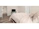 Relaxing bedroom with a queen bed, wood-look floors, and simple decor at 1513 Fletcher Broome Rd, Monroe, NC 28112