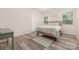 Serene bedroom featuring neutral tones, wood-look floors, and natural light at 1513 Fletcher Broome Rd, Monroe, NC 28112