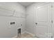 Laundry room with tile flooring and hookups at 15204 Caspian Way, Charlotte, NC 28278