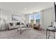 Modern living room with neutral color palette, large windows, and comfortable seating at 15204 Caspian Way, Charlotte, NC 28278