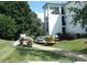 Exterior of a condo building with kayak storage on a grassy area at 17811 Half Moon Ln # C, Cornelius, NC 28031