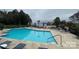Community pool with lounge chairs at 17811 Half Moon Ln # C, Cornelius, NC 28031