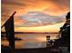 Gorgeous sunset with golden sky over the water at 17811 Half Moon Ln # C, Cornelius, NC 28031
