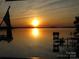 Beautiful sunset over the lake at dusk at 17811 Half Moon Ln # C, Cornelius, NC 28031