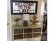 Charming decor featuring lake-themed elements such as a welcome sign, a lamp, and a driftwood anchor at 17811 Half Moon Ln # C, Cornelius, NC 28031