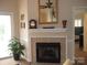 Elegant fireplace with tile surround, decorative mantel, and a view into the bedroom at 17811 Half Moon Ln # C, Cornelius, NC 28031