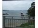 Enjoy breathtaking lake views from this balcony, complete with a private dock and a peaceful setting at 17811 Half Moon Ln # C, Cornelius, NC 28031