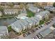 A beautiful aerial view of the condos, pool, and tranquil lake at 18832 Nautical Dr # 44, Cornelius, NC 28031