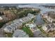 Aerial view showcasing the lakeside community with a pool, lake, and multiple condo buildings at 18832 Nautical Dr # 44, Cornelius, NC 28031
