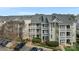 An eye-level view of condo buildings with large balconies and lush shrubbery at 18832 Nautical Dr # 44, Cornelius, NC 28031