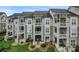 A ground-level view of condo buildings with private patios and manicured lawns at 18832 Nautical Dr # 44, Cornelius, NC 28031