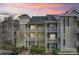Inviting condo building with multiple floors and private balconies in a beautifully landscaped complex at 18832 Nautical Dr # 44, Cornelius, NC 28031