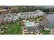 A bird's eye view of the pristine community pool and lush green landscaping at 18832 Nautical Dr # 44, Cornelius, NC 28031