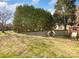 Large, well-maintained backyard with mature trees offering privacy and shade at 1896 Independence Sq, Kannapolis, NC 28081
