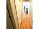 Hallway with hardwood floors that leads to an open-concept living space at 1896 Independence Sq, Kannapolis, NC 28081