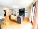 Cozy living room with a large sofa, mounted TV, and access to the outdoors at 1896 Independence Sq, Kannapolis, NC 28081
