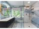 Modern bathroom with elegant double vanity, stylish mirrors, and luxurious tiled shower at 196 Gabriel Dr, Mooresville, NC 28115