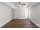 Spacious bedroom featuring a tray ceiling and hardwood floors at 196 Gabriel Dr, Mooresville, NC 28115