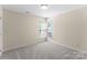 Bright bedroom with two windows letting in natural light, freshly painted with neutral colors at 196 Gabriel Dr, Mooresville, NC 28115