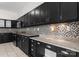 Kitchen featuring extensive dark cabinetry, granite countertops, and tile flooring at 196 Gabriel Dr, Mooresville, NC 28115