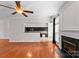 Cozy living room with fireplace, open layout and hardwood floors, bathed in natural light at 196 Gabriel Dr, Mooresville, NC 28115