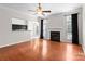 Open-concept living space featuring a fireplace and a view of the adjacent kitchen at 196 Gabriel Dr, Mooresville, NC 28115