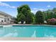 Backyard swimming pool with lounge chairs and lush landscaping, an oasis for relaxation and entertainment at 196 Gabriel Dr, Mooresville, NC 28115