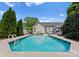 Backyard swimming pool with lounge chairs and outdoor seating, perfect for relaxation and entertaining at 196 Gabriel Dr, Mooresville, NC 28115