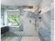 Modern shower with marble tile surround and upscale brass fixtures at 196 Gabriel Dr, Mooresville, NC 28115