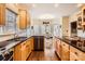 Kitchen with stainless steel appliances, black countertops and an island with seating overlooking dining area at 200 Elizabeth Dr, Stanfield, NC 28163