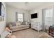 Cozy bedroom designed as a Bedroom featuring a sofa, crib, neutral walls, and carpet flooring at 2147 Stevens Mill Rd, Matthews, NC 28104