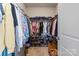 Spacious walk-in closet with ample storage, shelves, and organized hanging racks at 2147 Stevens Mill Rd, Matthews, NC 28104