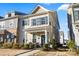Charming two-story home with gray shutters, covered front porch, and lush landscaping at 2147 Stevens Mill Rd, Matthews, NC 28104