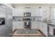 Stylish kitchen with stainless appliances, granite countertops, and ample cabinet space at 2147 Stevens Mill Rd, Matthews, NC 28104