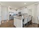 Well-equipped kitchen with stainless steel appliances, granite countertops, and hardwood floors at 2147 Stevens Mill Rd, Matthews, NC 28104
