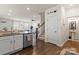 Open kitchen with stainless steel appliances, granite countertops, and hardwood flooring at 2147 Stevens Mill Rd, Matthews, NC 28104