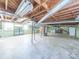 Spacious unfinished basement with exposed beams, support pillars, and concrete flooring at 2310 Clay St, Kannapolis, NC 28083