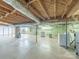 Spacious unfinished basement with exposed wood beams, utilities, and laundry area at 2310 Clay St, Kannapolis, NC 28083