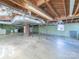 Unfinished basement with concrete floor, wood support beams and some utilities at 2310 Clay St, Kannapolis, NC 28083