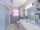 Bathroom featuring a shower, vanity with marble countertop, and decorative wallpaper at 2310 Clay St, Kannapolis, NC 28083