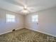 Comfortable bedroom with neutral walls, and bright ceiling fan at 2310 Clay St, Kannapolis, NC 28083