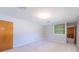 A simple, carpeted bedroom with built-in shelving and neutral paint colors at 2310 Clay St, Kannapolis, NC 28083